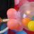 Gumballs are used as the topper for balloon baby rattles. Great for baby shower balloon decorating!